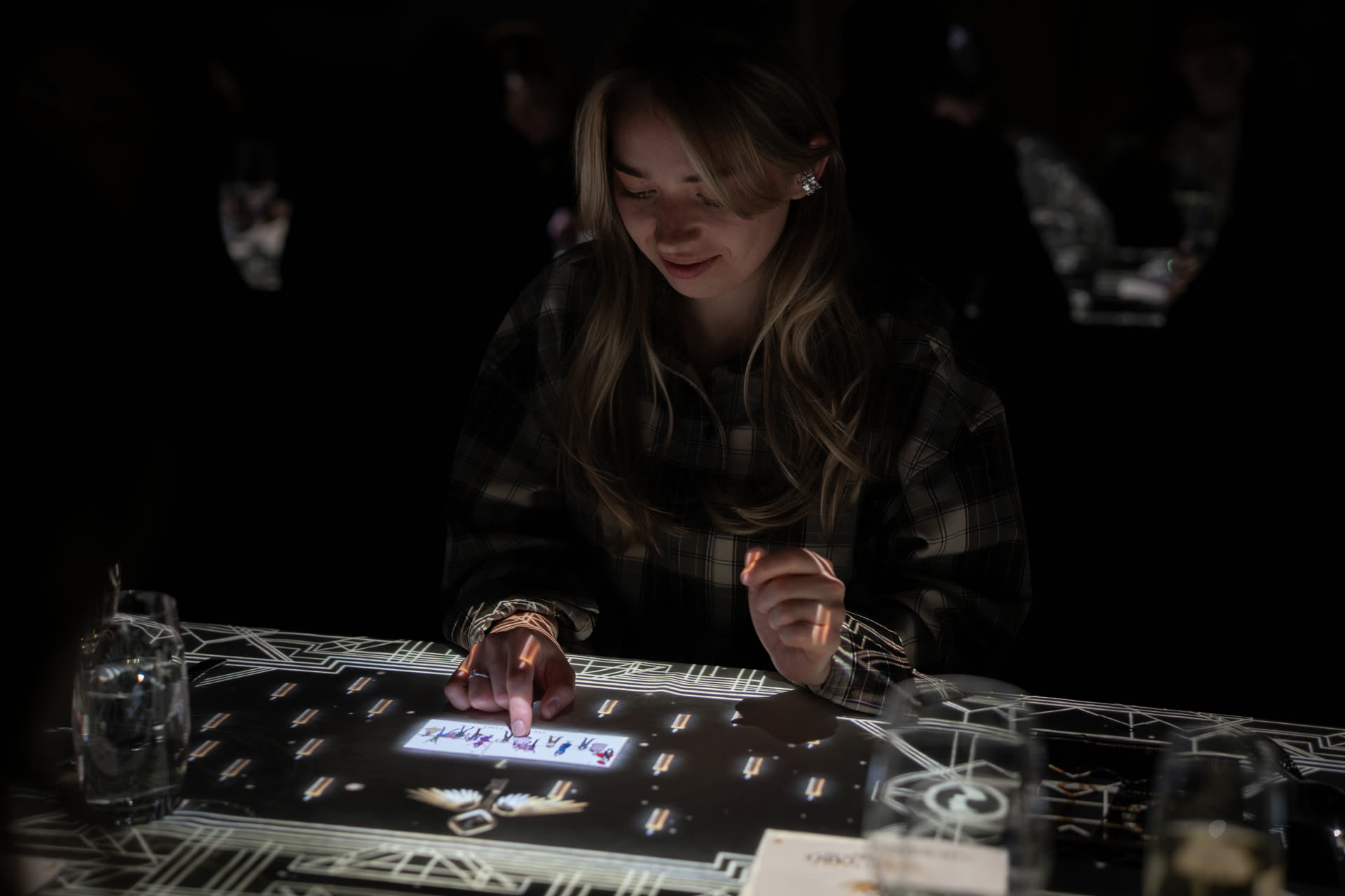 The Magic Table Calgary — guests experiencing interactive illusions at the table
